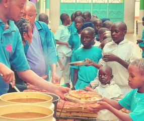 Children being served food.